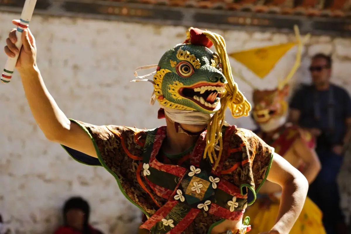 Masked Dancers at Rhododendron Festival in Bhutan